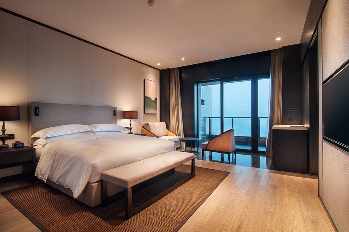 Suite with a balcony and floor to ceiling windows